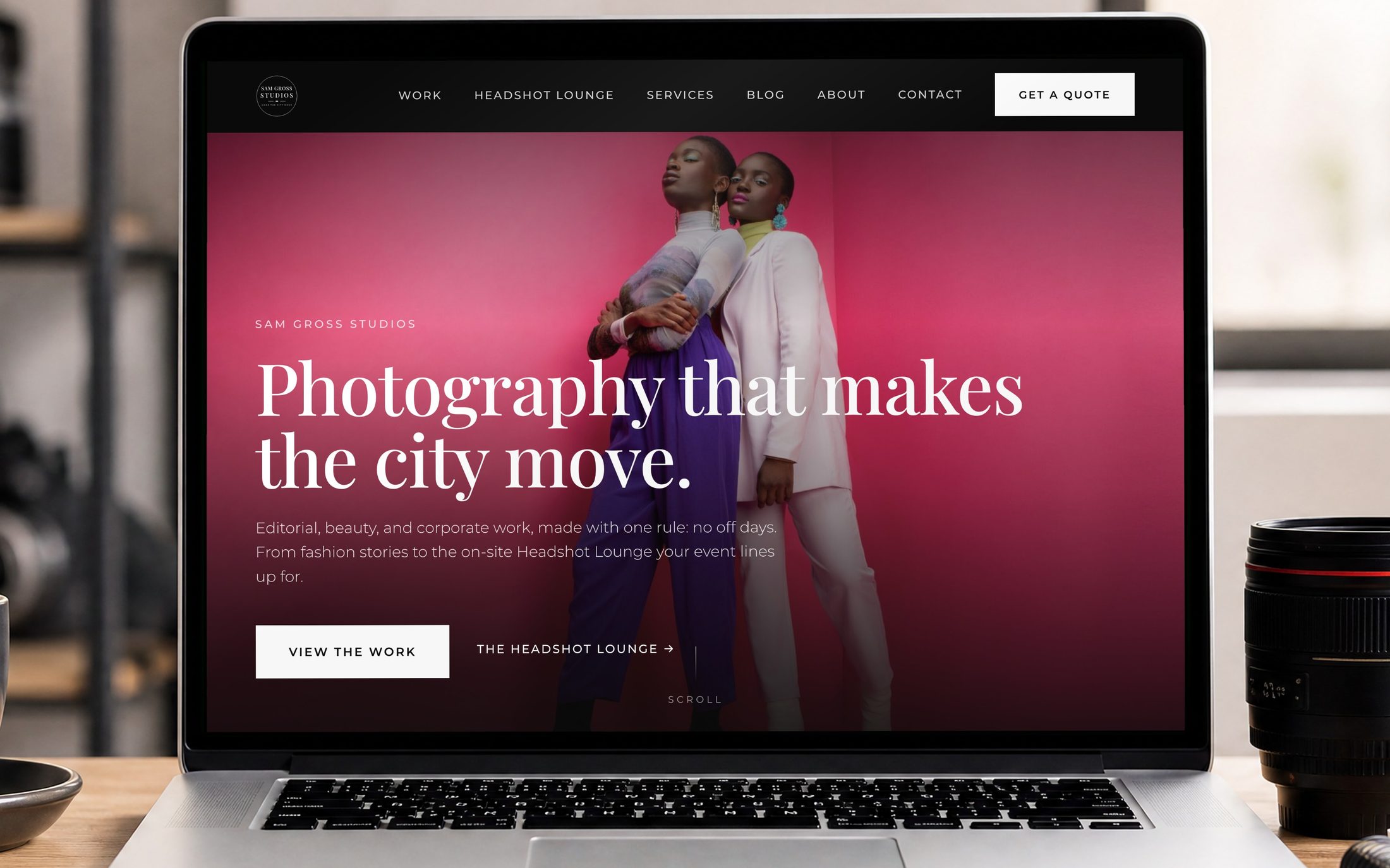 The Sam Gross Studios website on a laptop in a photography studio